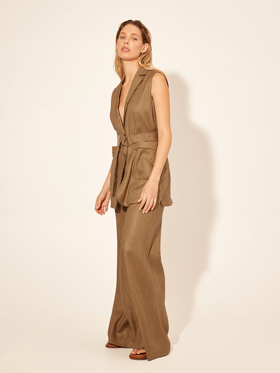 Penelope Vest KIVARI | Model wears brown tailored vest side view