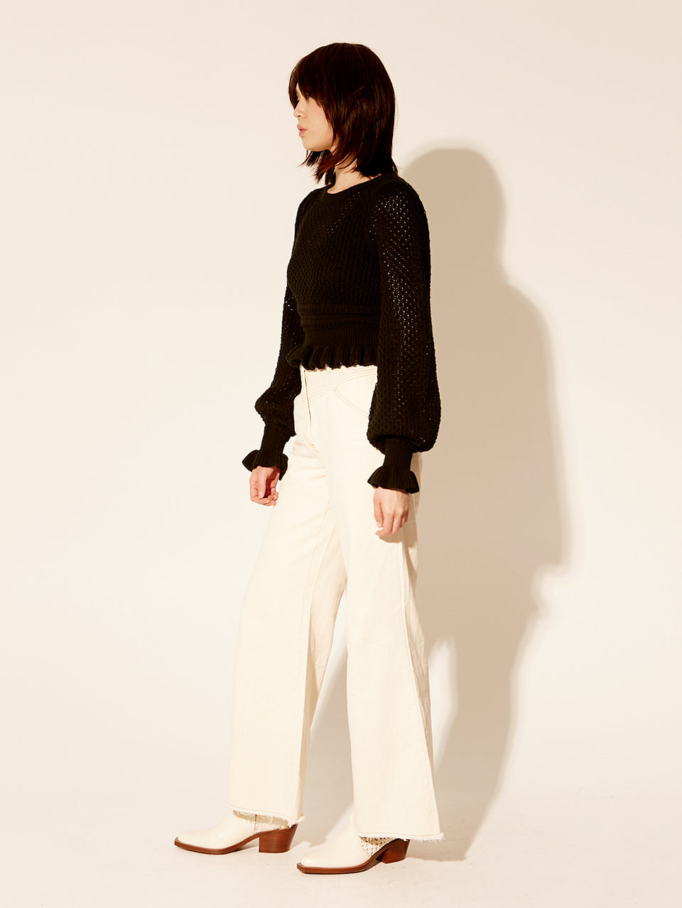 Rafaela Knit Top KIVARI | Model wears black knit top side view