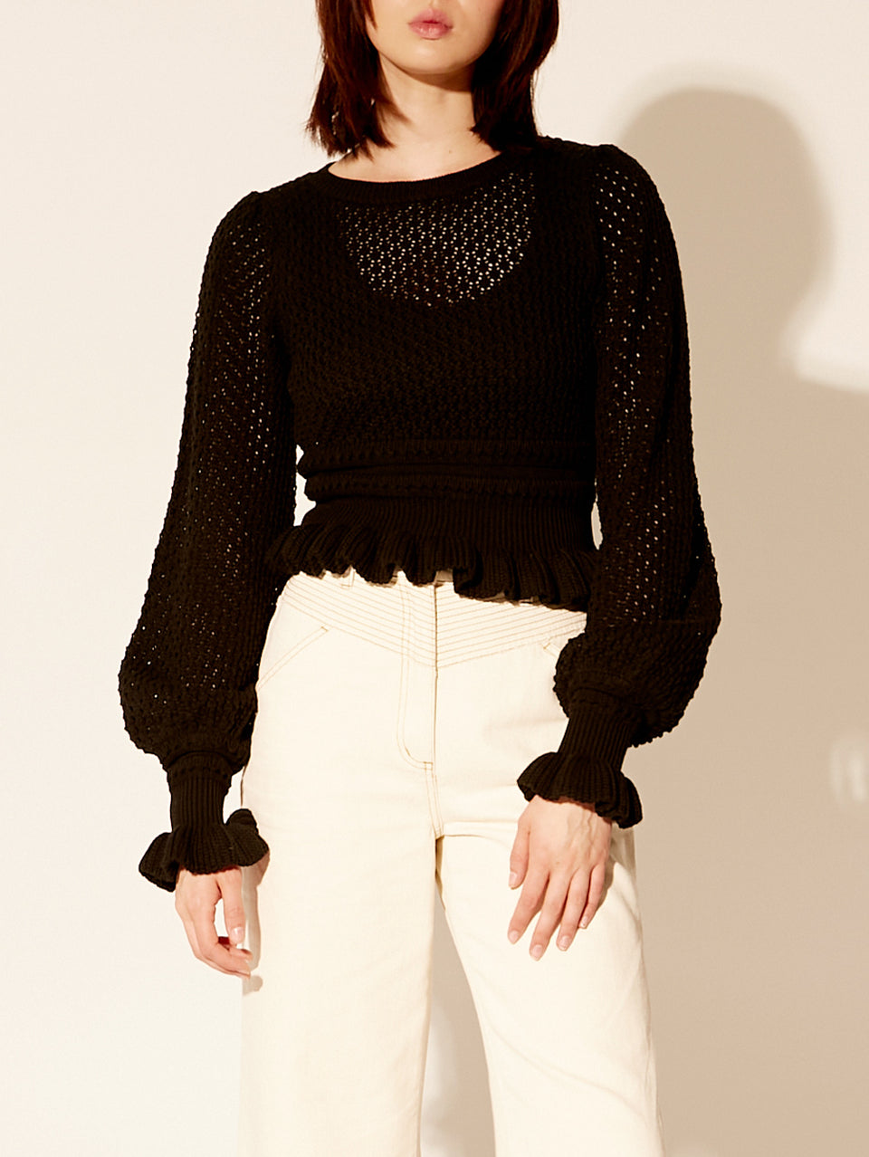 Rafaela Knit Top KIVARI | Model wears black knit top close up