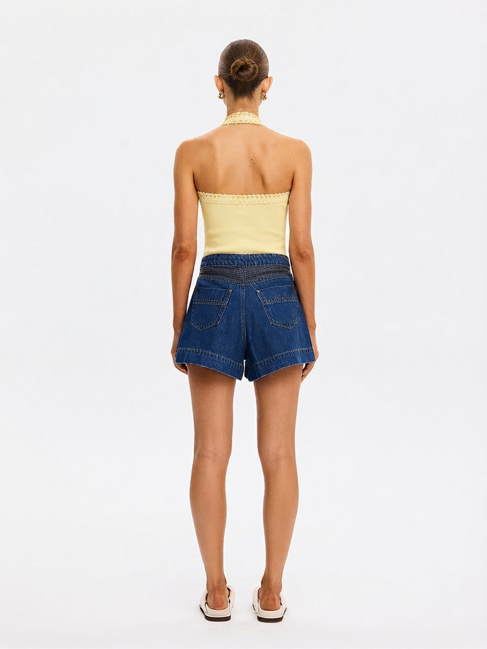 Rhea Halter Top in Butter yellow, back view of halter-neck top styled with denim shorts and sandals