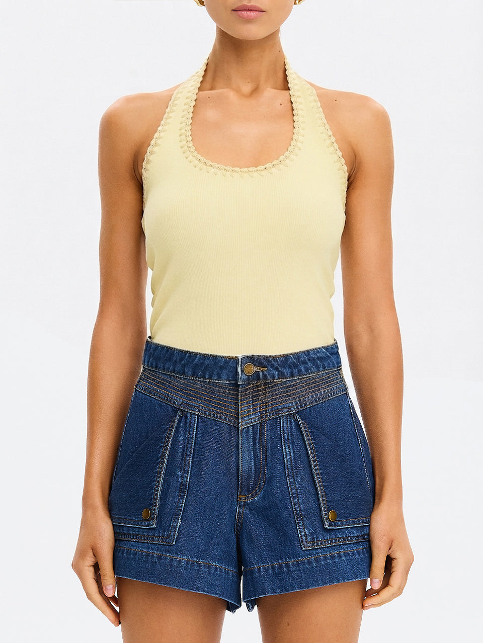 Rhea Halter Top in Butter yellow, close-up of halter-neck knit top with scalloped trim, paired with denim shorts
