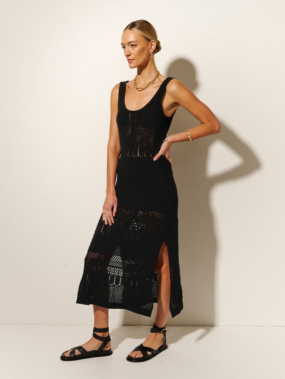 Riza Crochet Midi Dress KIVARI | Model wears black crochet midi dress side view
