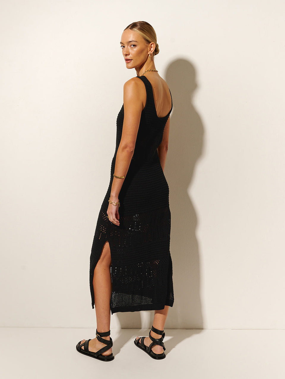 Riza Crochet Midi Dress KIVARI | Model wears black crochet midi dress back view