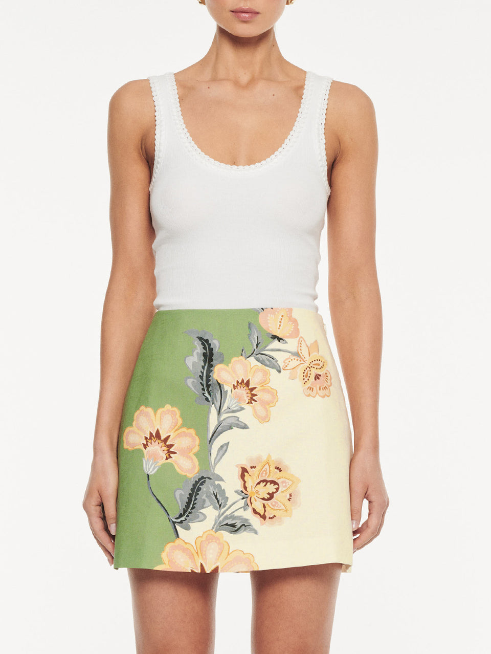 Lotte Mini Skirt in Green Cream, close-up of high-waisted A-line mini skirt with floral print
