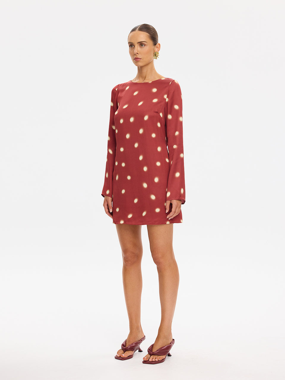 KIVARI Saro Mini Dress in Brick – long-sleeve polka dot mini dress, scoop neckline front view