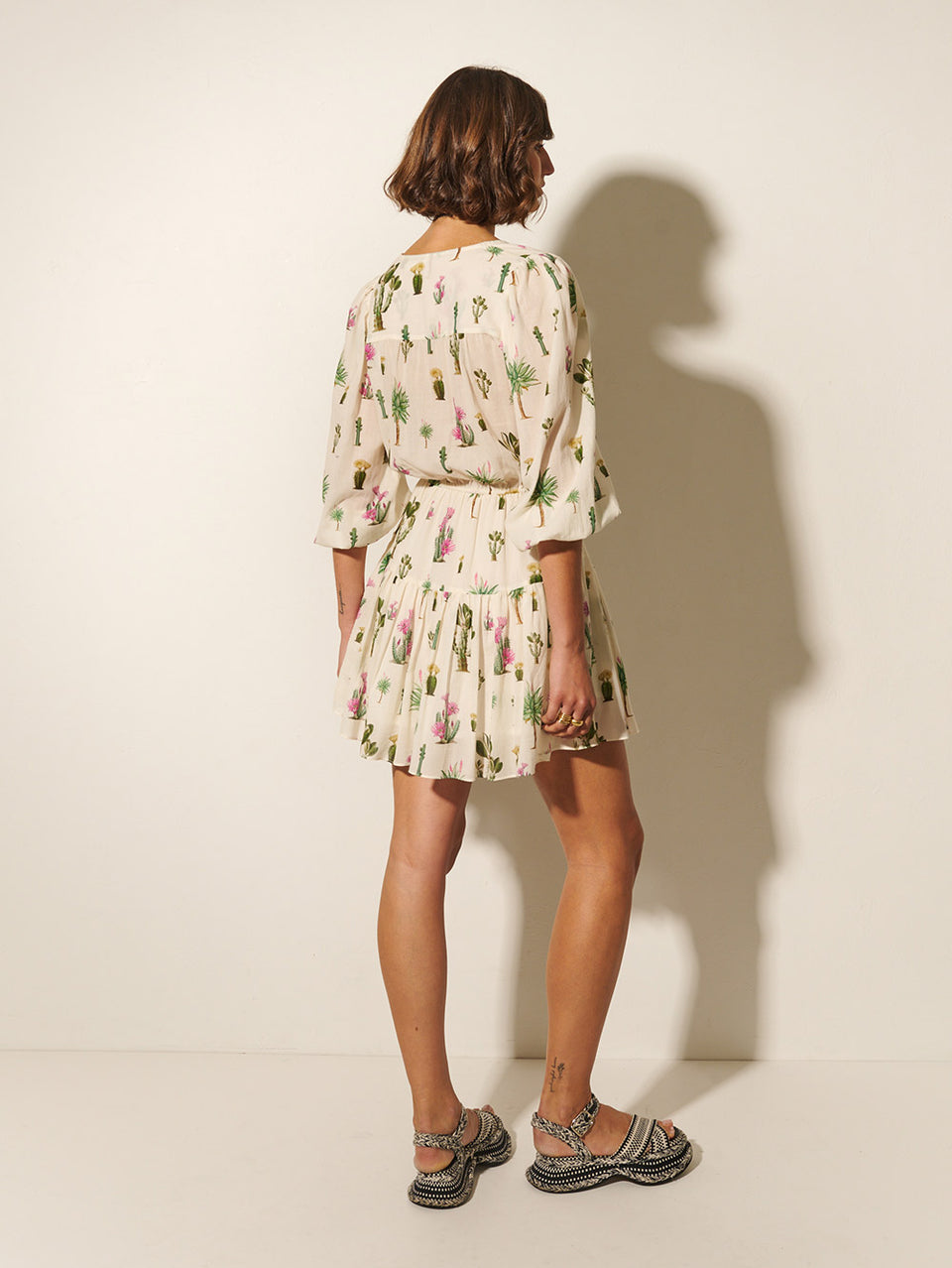 Saguaro Mini Dress KIVARI | Model wears cactus print mini dress back view