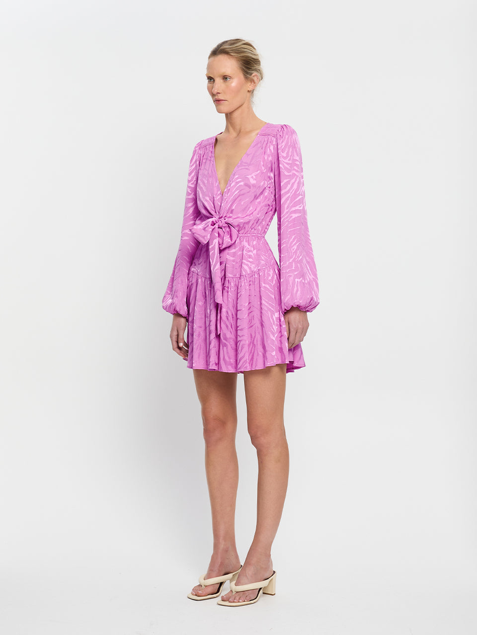 Stela Tie Front Mini Dress KIVARI | Model wears pink zebra print mini dress side view