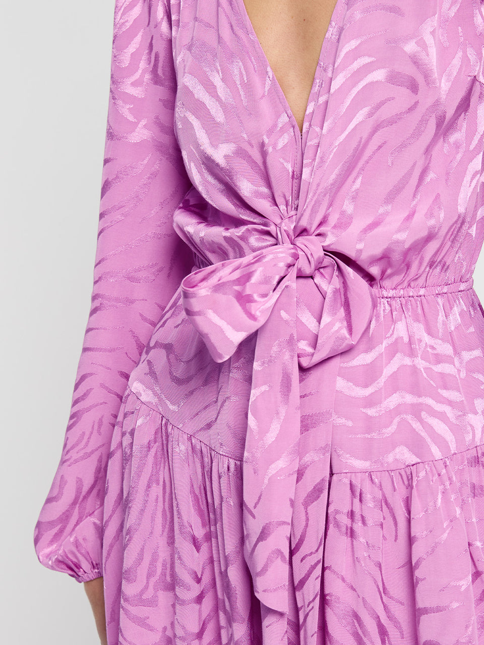 Stela Tie Front Mini Dress KIVARI | Model wears pink zebra print mini dress close up