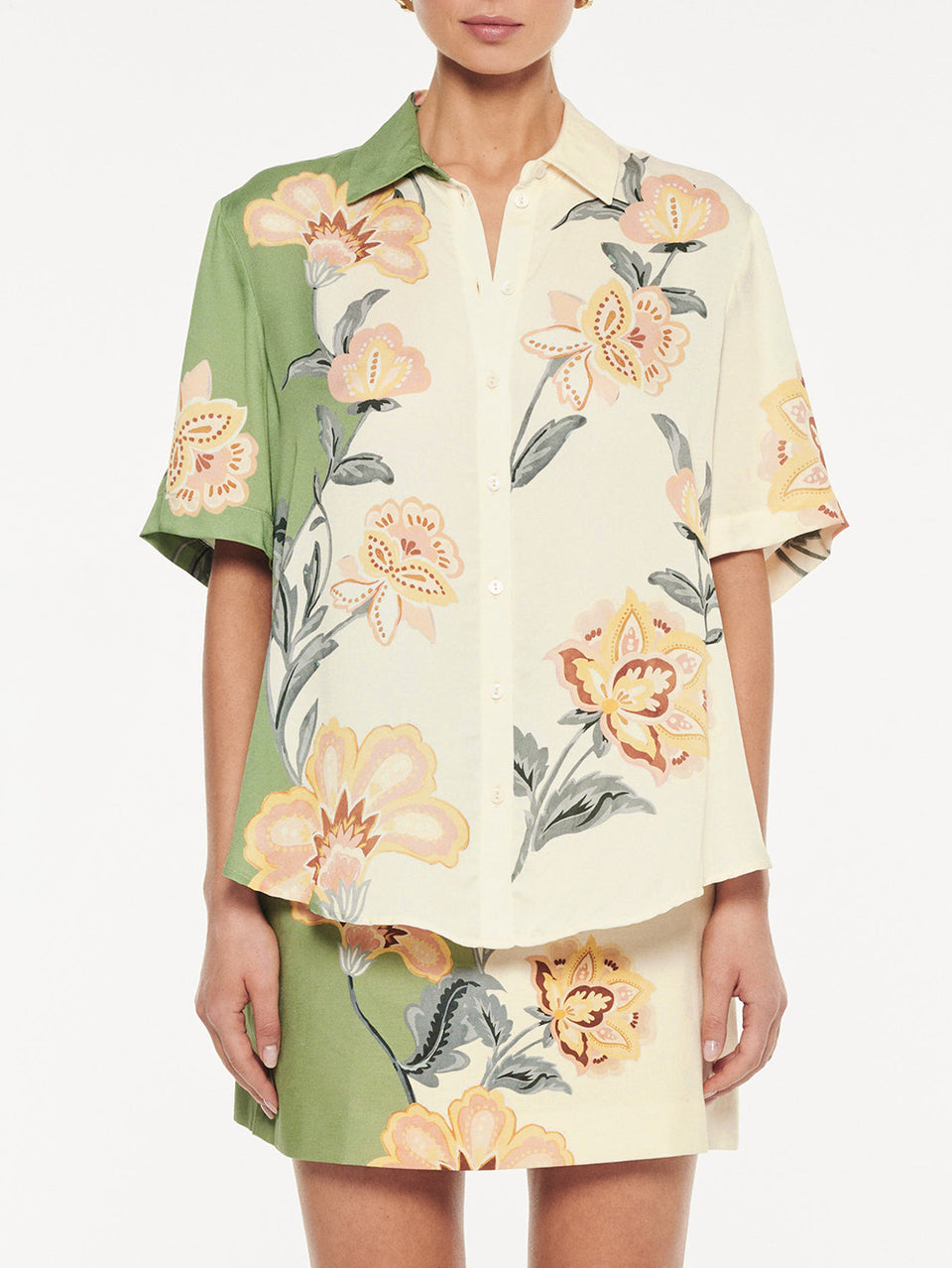 Lotte Shirt in Green Cream, close-up of button-up shirt and mini skirt set with floral print