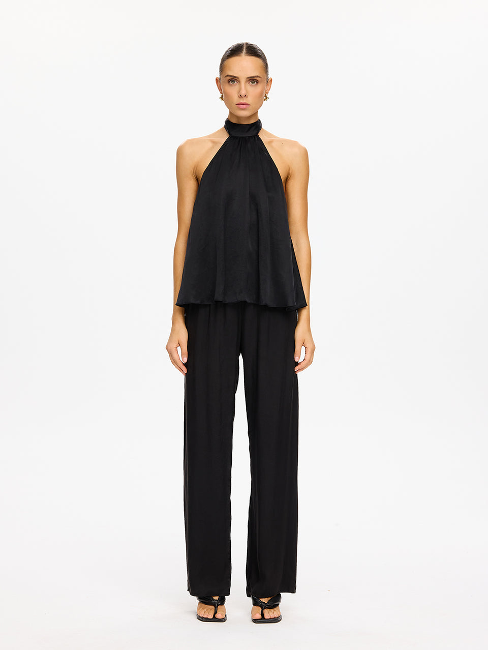 KIVARI Jaxon Halter Top in Black – full-length front view of model wearing women's black halter neck top with matching wide-leg pants