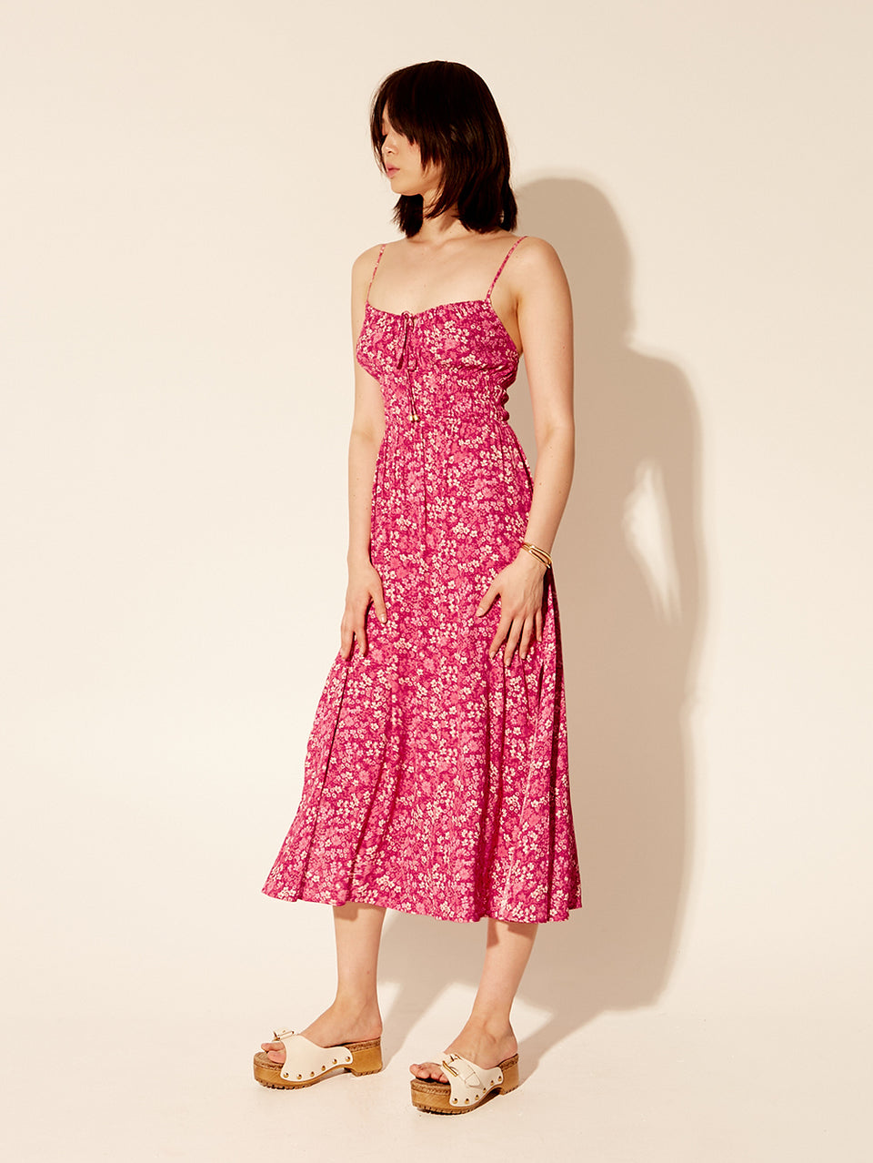 Tamara Strappy Midi Dress KIVARI | Model wears pink floral strappy midi dress side view