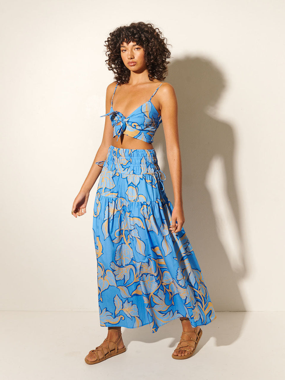 Taniana Crop Top KIVARI | Model wears blue floral crop top with matching skirt side view