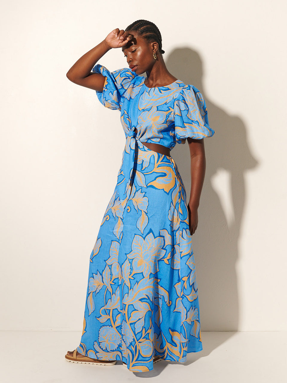 Taniana Cut Out Maxi Dress KIVARI | Model wears blue and orange floral maxi dress side view