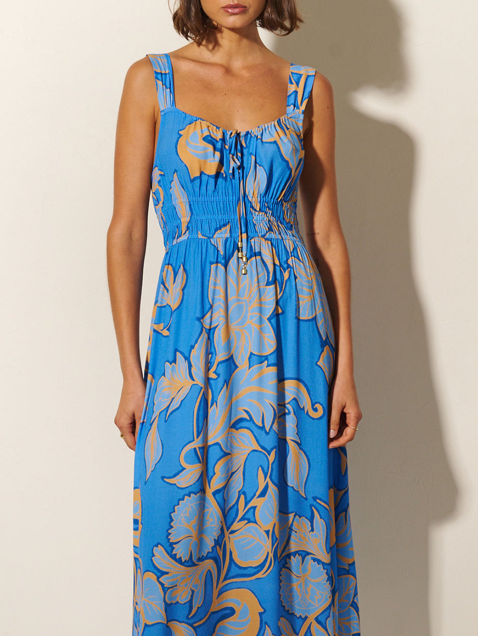 Taniana Midi Dress KIVARI | Model wears blue and orange floral midi dress close up