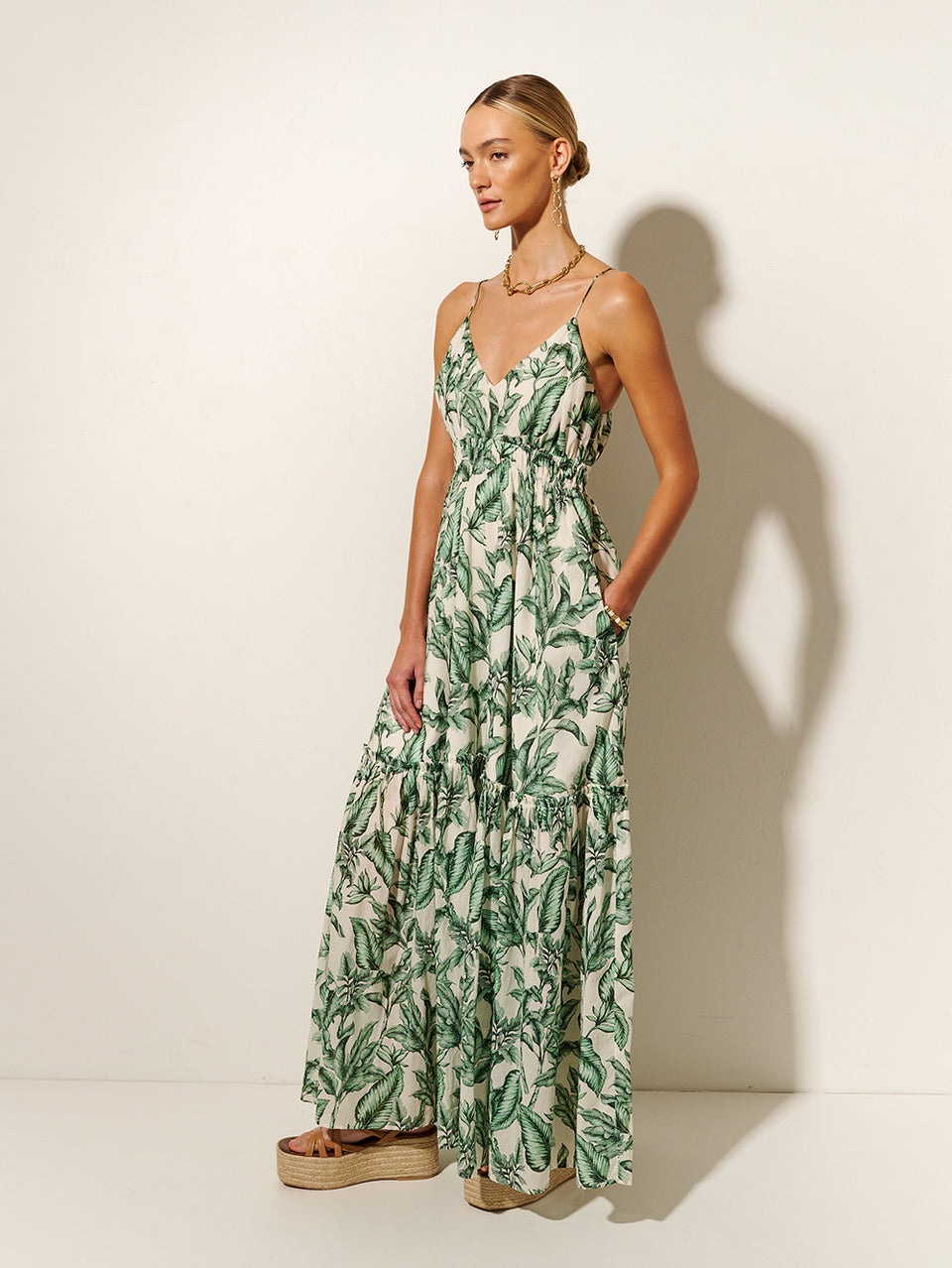 Tropico Maxi Dress KIVARI | Model wears palm leaf printed maxi dress side view