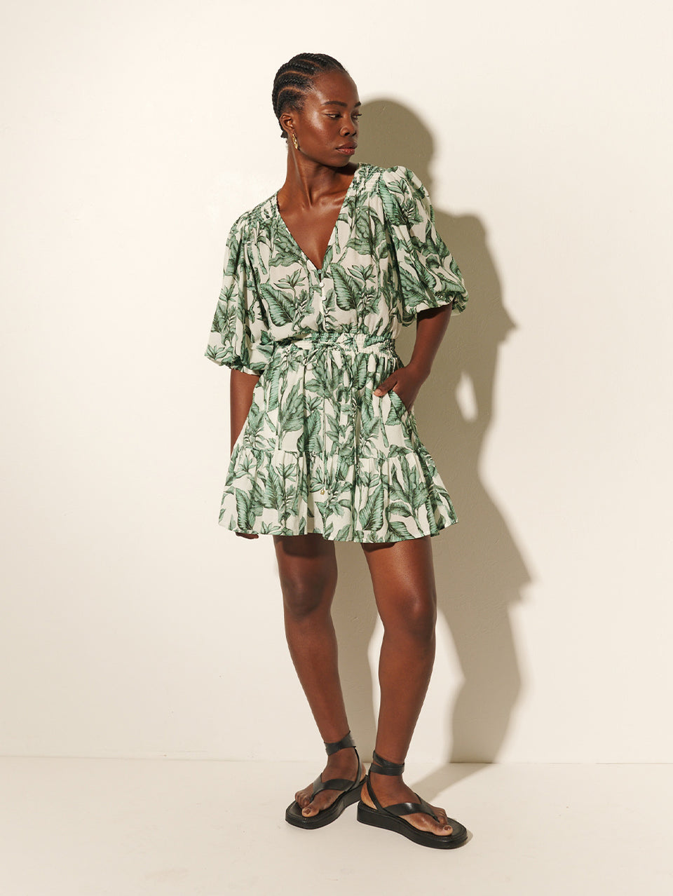 Tropico Mini Dress KIVARI | Model wears palm leaf printed mini dress