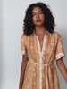 Sienna Midi Dress KIVARI | Model wears orange print midi dress