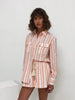 KIVARI Mae Shirt | Video of model wearing pink and orange striped shirt and short set
